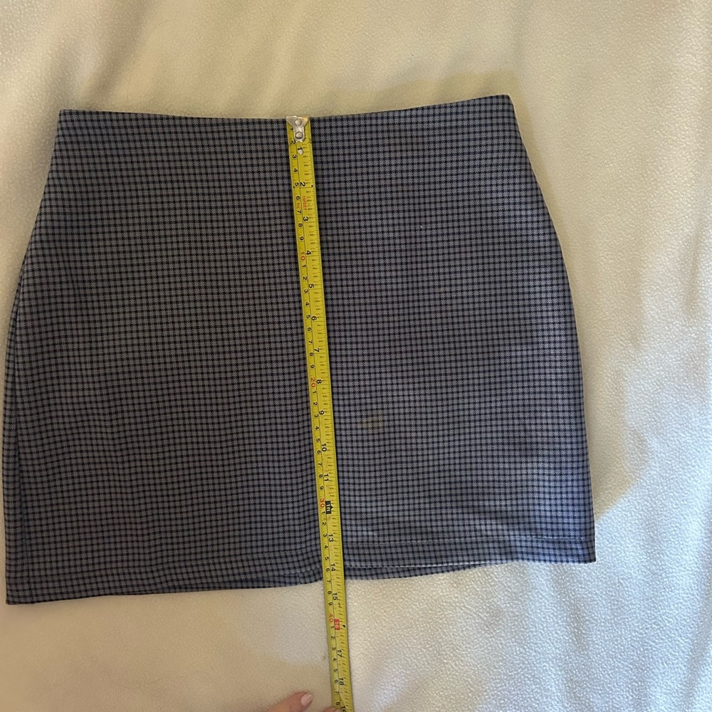 SOLD.     
Classic Black and Gray Checkered Mini by Urban Outfitters.